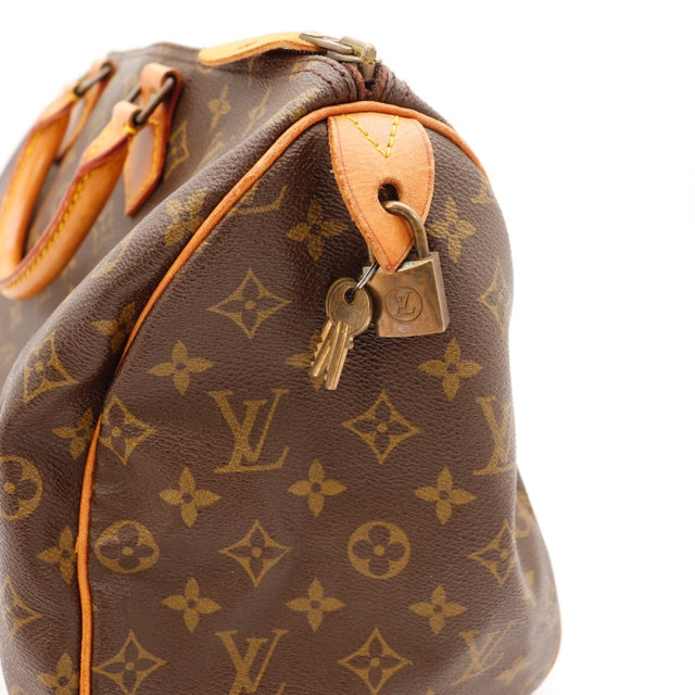 Détail de la fermeture éclair Louis Vuitton Speedy 35 Toile Monogramme occasion authentique — AMANA Vintage