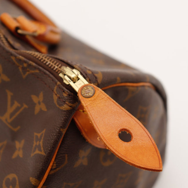 Détail languette cadenas percée Louis Vuitton Speedy 35 — AMANA Vintage