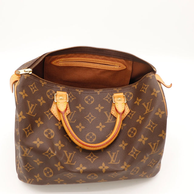 Vue de profil Louis Vuitton Speedy 30 Toile Monogramme occasion authentique — AMANA Vintage