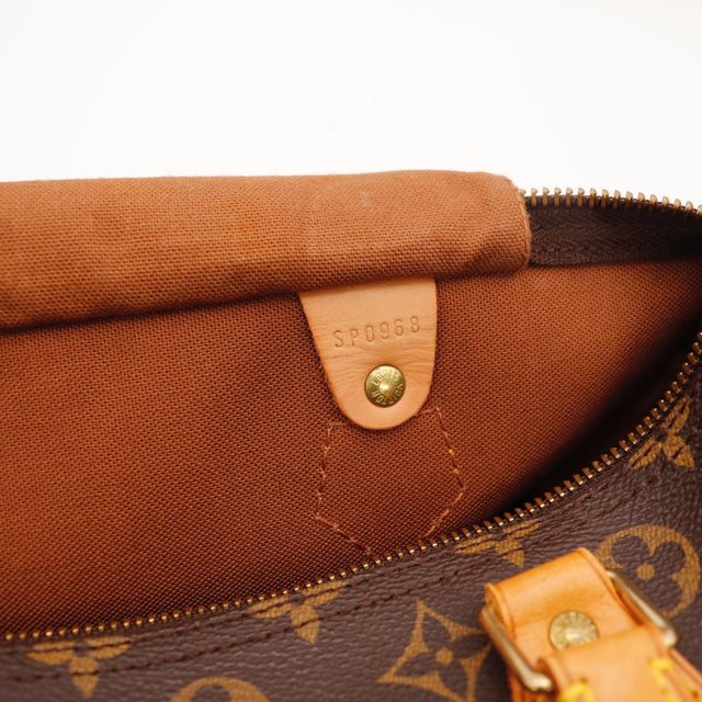 Détail des anses Louis Vuitton Speedy 30 cuir vachette occasion authentique — AMANA Vintage
