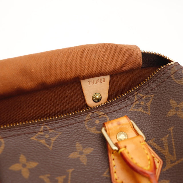 Détail du cadenas Louis Vuitton Speedy 25 Toile Monogramme occasion authentique — AMANA Vintage