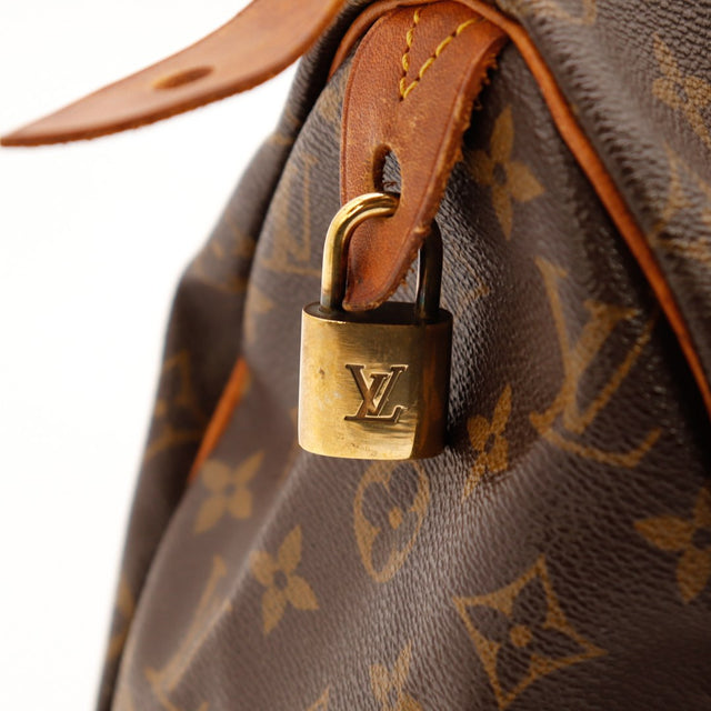 Détail anse cuir vachette patine caramel Louis Vuitton Speedy 25 — AMANA Vintage