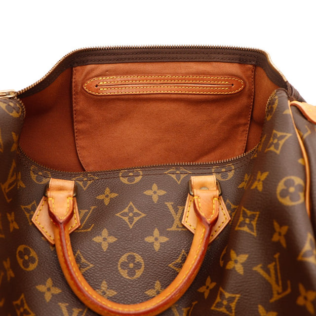 Détail languette cadenas et tirette cuir Louis Vuitton Speedy 35 — AMANA Vintage