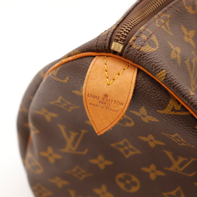 Détail zip et garnitures cuir vachette patine caramel Louis Vuitton Speedy 35 — AMANA Vintage