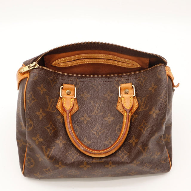 Détail des anses Louis Vuitton Speedy 25 cuir vachette occasion authentique — AMANA Vintage