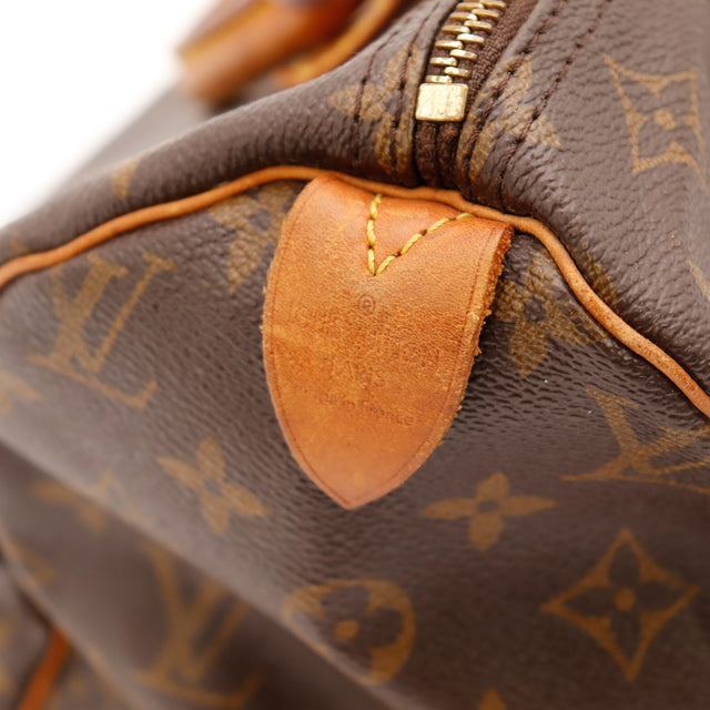 Détail tab de fermeture côté gauche Louis Vuitton Speedy 30 — AMANA Vintage