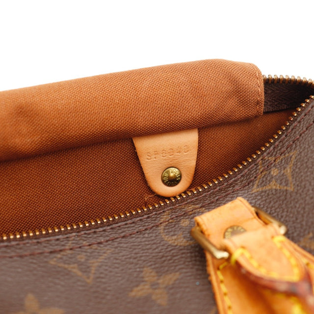 Détail de la fermeture Louis Vuitton Speedy 25 Toile Monogramme occasion authentique — AMANA Vintage