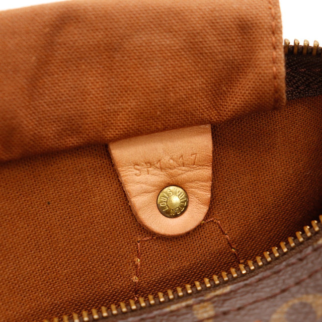 Détail poche intérieure Louis Vuitton Speedy 30 pression vachette — AMANA Vintage