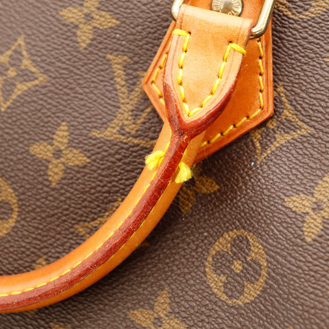 Détail languette cadenas cuir vachette Louis Vuitton Speedy 30 — AMANA Vintage