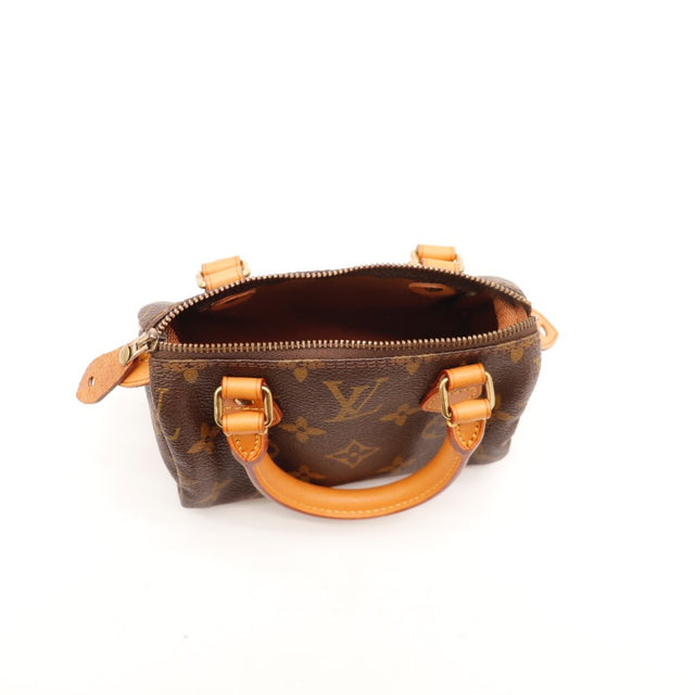 Détail des anses Louis Vuitton Mini Speedy cuir vachette occasion authentique — AMANA Vintage