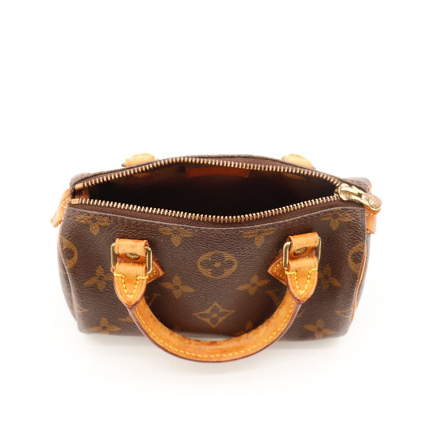 Détail des anses Louis Vuitton Mini Speedy cuir vachette occasion authentique — AMANA Vintage