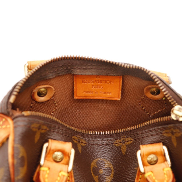 Détail de la patine Louis Vuitton Mini Speedy cuir vachette occasion authentique — AMANA Vintage