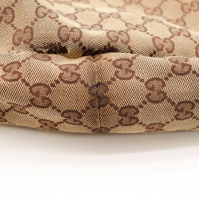 Détail base et couture du sac Gucci Tote toile monogrammée — AMANA Vintage