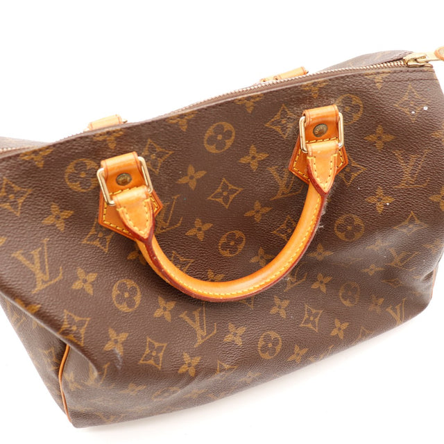 Détail anses cuir vachette patine caramel Louis Vuitton Speedy 30 — AMANA Vintage