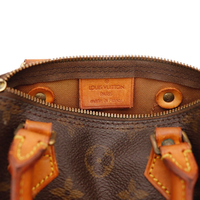 Détail des anses Louis Vuitton Mini Speedy cuir vachette occasion authentique — AMANA Vintage