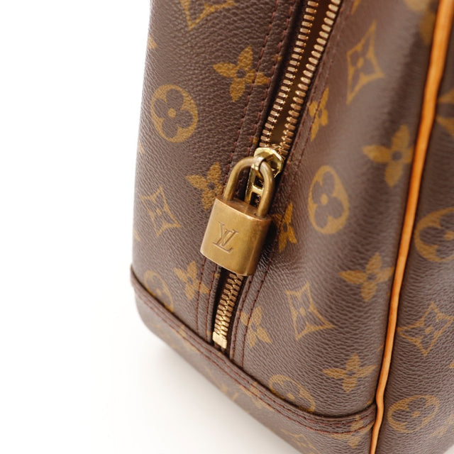 Détail du cadenas Louis Vuitton Deauville argenterie dorée occasion authentique — AMANA Vintage