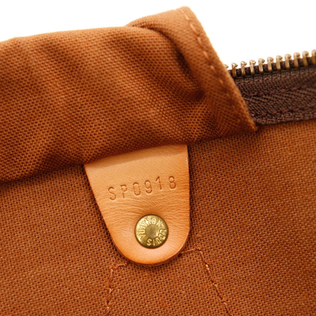 Détail languette fermeture éclair Louis Vuitton Speedy 35 cuir vachette craquelé — AMANA Vintage