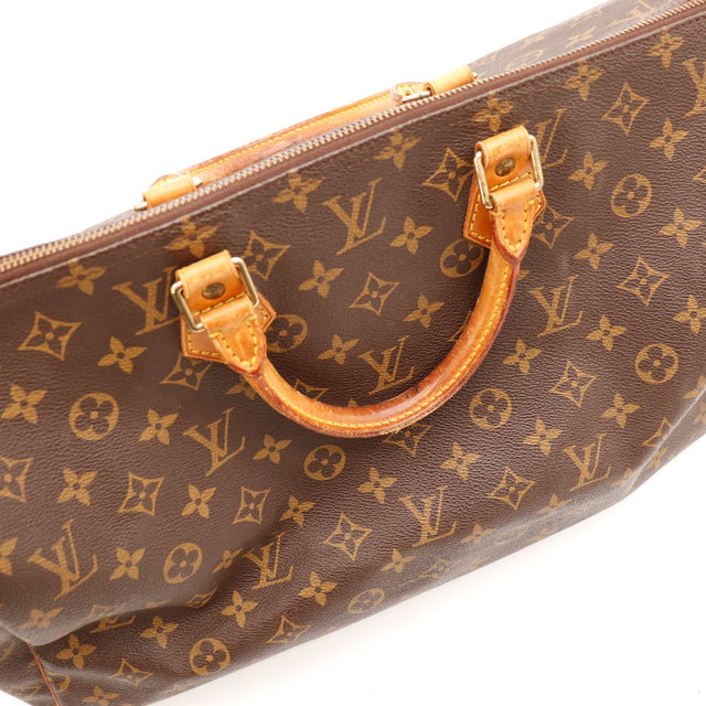 Détail anses et tab de cuir vachette Louis Vuitton Speedy 40 — AMANA Vintage
