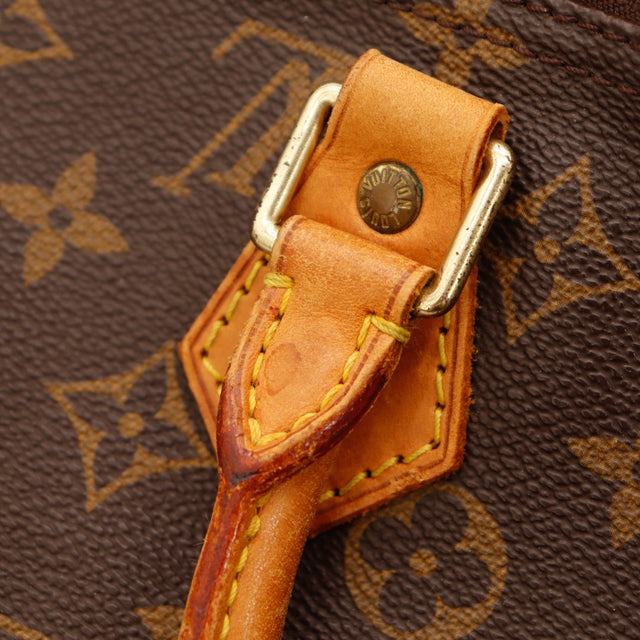 Détail tab et attache anse Louis Vuitton Speedy 40 tache sur cuir vachette — AMANA Vintage