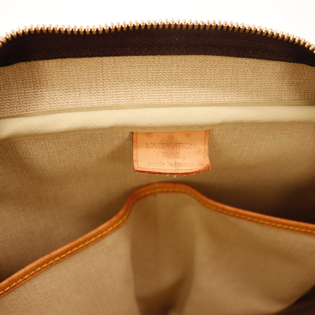 Détail de l'argenterie dorée Louis Vuitton Deauville Toile Monogramme occasion authentique — AMANA Vintage