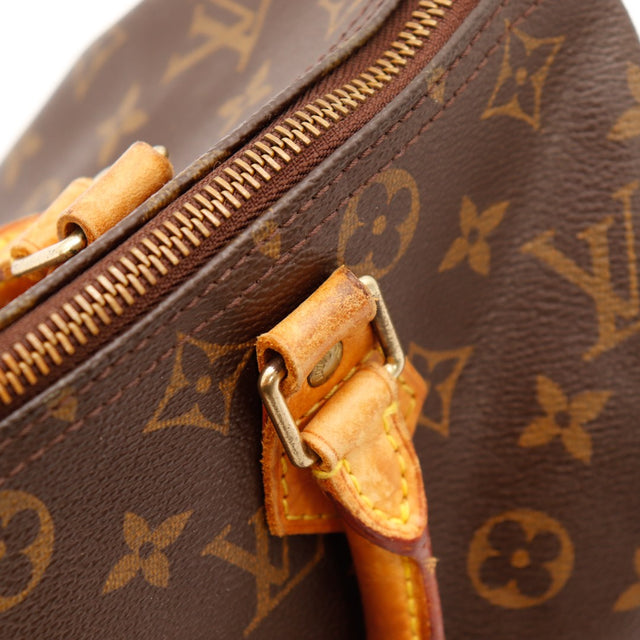Détail attaches anses cuir vachette assombri Louis Vuitton Speedy 30 — AMANA Vintage