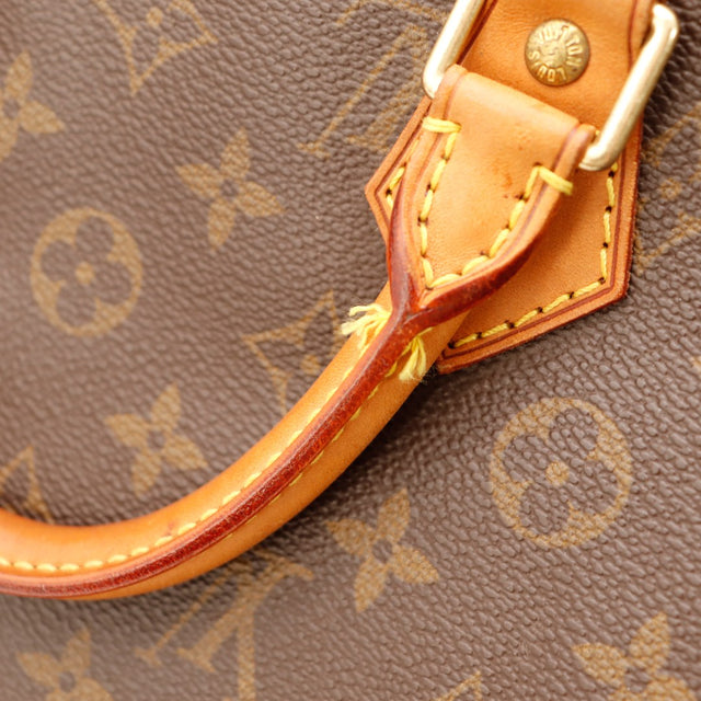 Détail attache d'anse cuir vachette patine caramel Louis Vuitton Speedy 35 — AMANA Vintage