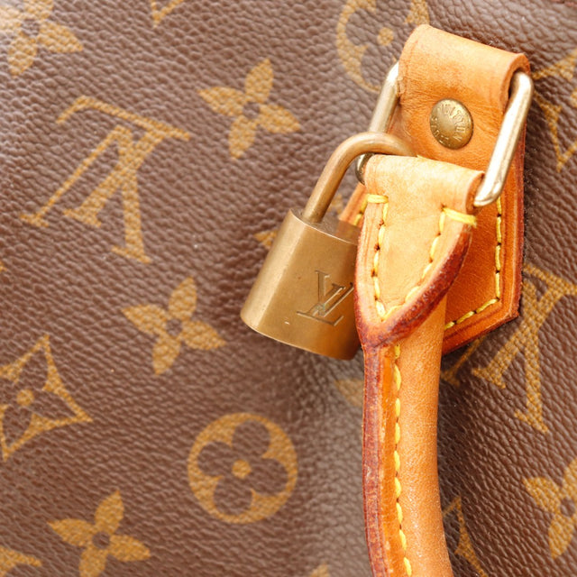Détail cadenas Louis Vuitton Speedy 30 languette vachette patinée — AMANA Vintage