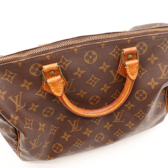 Détail anses et fermeture Louis Vuitton Speedy 30 — AMANA Vintage