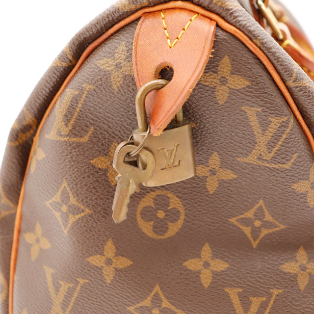 Détail cadenas et clés Louis Vuitton Speedy 25 — AMANA Vintage