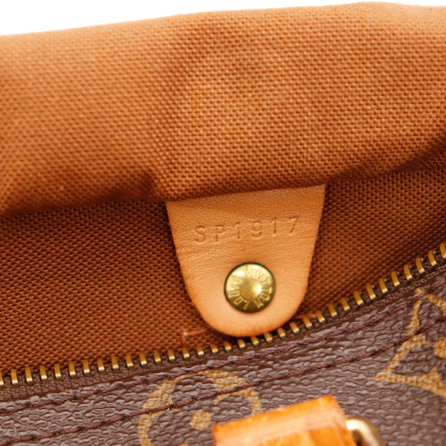 Détail languette cadenas usée cuir effrité Louis Vuitton Speedy 25 — AMANA Vintage