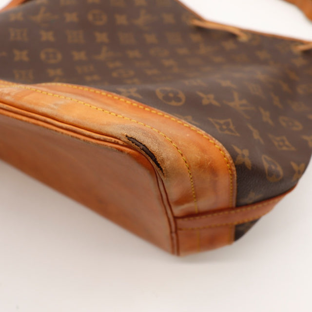 Détail des œillets et de la ficelle Louis Vuitton Noé Toile Monogramme occasion authentique — AMANA Vintage