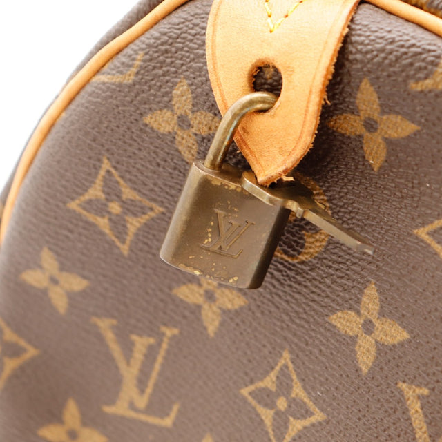Détail cadenas Louis Vuitton Speedy 35 patine — AMANA Vintage