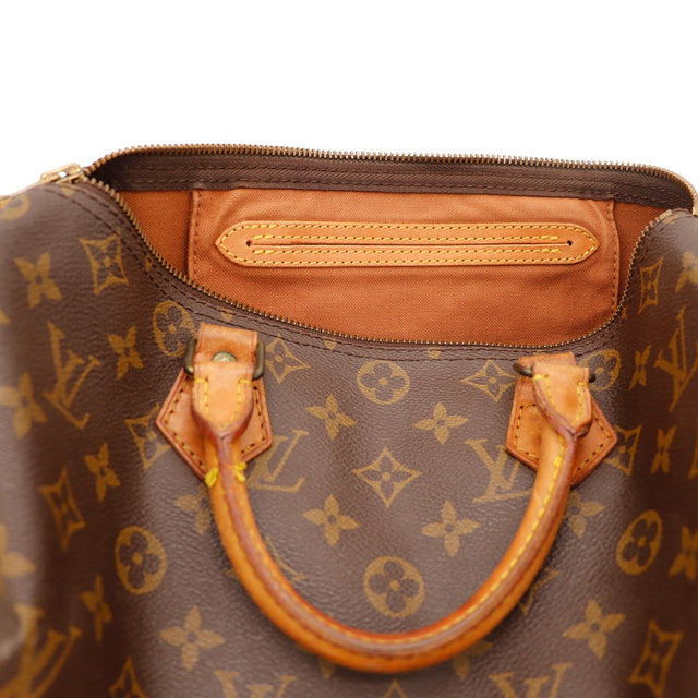 Détail tirette et languette cadenas usées Louis Vuitton Speedy 30 — AMANA Vintage