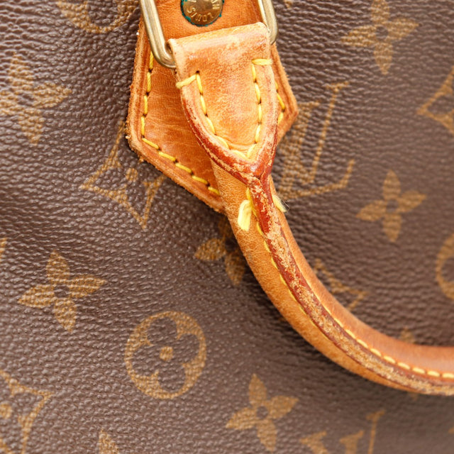 Detail attache d'anse cuir vachette Louis Vuitton Speedy 30 — AMANA Vintage
