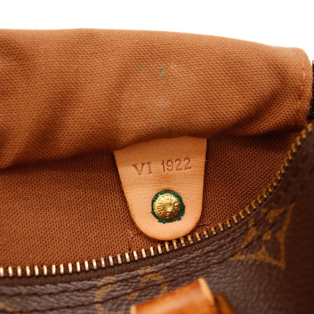 Détail languette cadenas fissurée Louis Vuitton Speedy 25 — AMANA Vintage