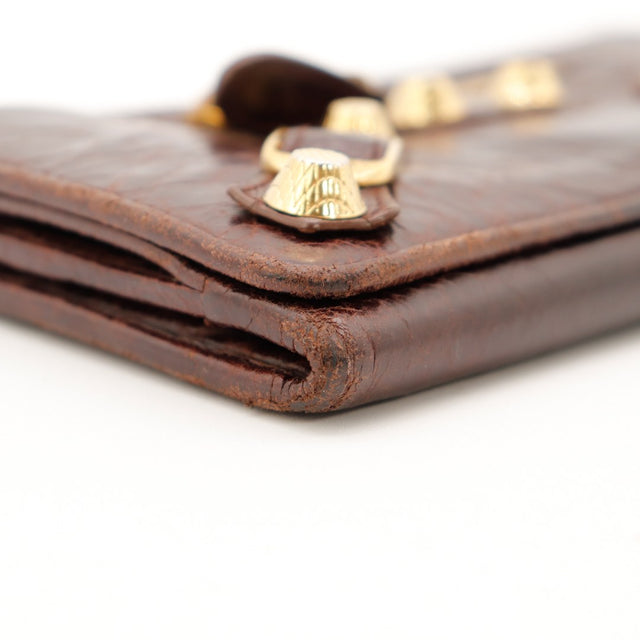 Detail coin superieur portefeuille Balenciaga marron rivets dores usure — AMANA Vintage