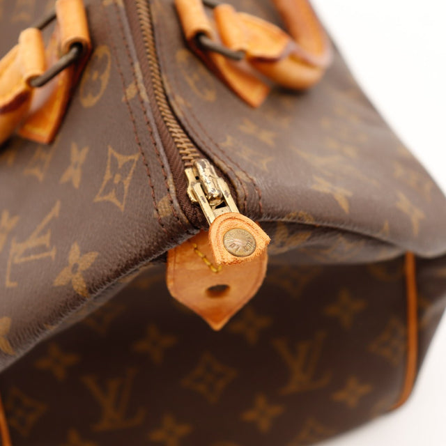 Détail tirette zip et languette cadenas Louis Vuitton Speedy 30 — AMANA Vintage