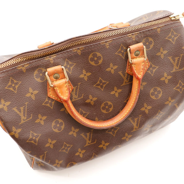 Détail anses cuir vachette patine caramel Louis Vuitton Speedy 30 — AMANA Vintage