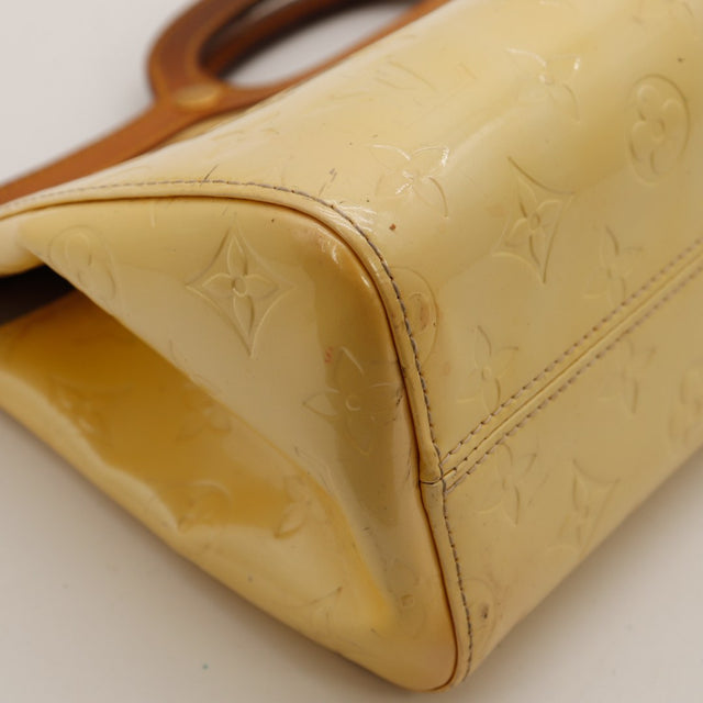 Détail coin inférieur gauche Louis Vuitton Roxbury Drive vernis écaillé — AMANA Vintage