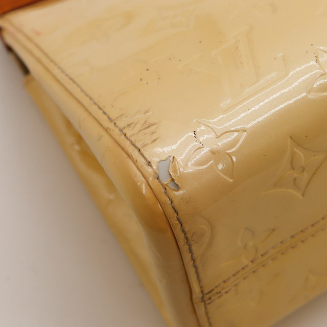 Détail transfert de couleur rose sur Vernis Louis Vuitton Roxbury Drive — AMANA Vintage