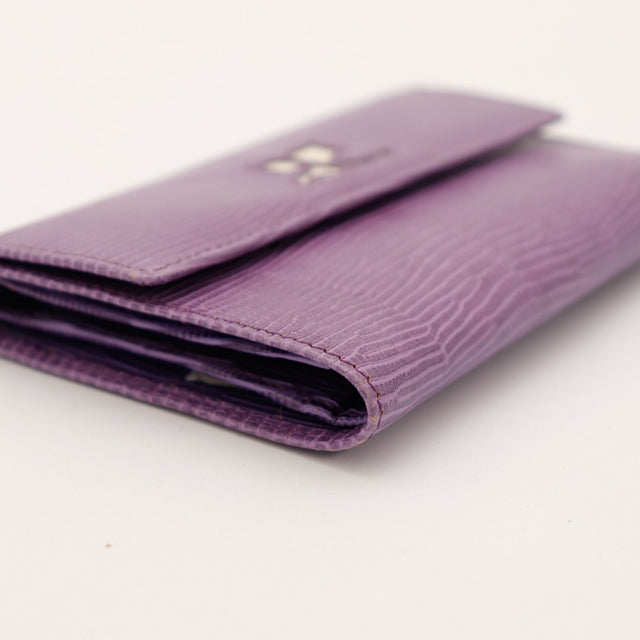 Tranche portefeuille Courrèges cuir lézard violet occasion — AMANA Vintage