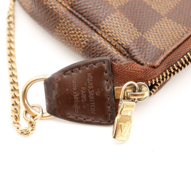 Détail curseur zip Louis Vuitton Pochette Accessoires Damier Ébène authentique — AMANA Vintage