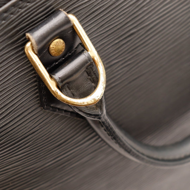 Détail anneau D et attache anse Louis Vuitton Alma PM Épi noir — AMANA Vintage