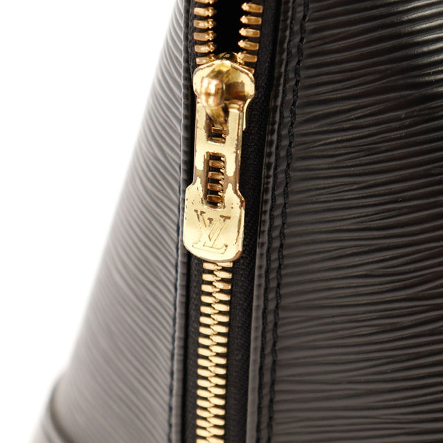 Détail curseur zip doré usé Louis Vuitton Alma PM Épi noir — AMANA Vintage