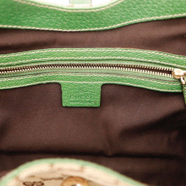 Détail coin inférieur cuir vert Gucci Jackie occasion authentique — AMANA Vintage