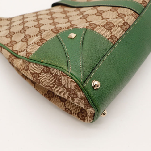 Vue de profil Gucci Jackie toile monogrammée beige occasion authentique — AMANA Vintage