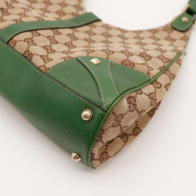 Détail clous dorés et pieds Gucci Jackie occasion authentique — AMANA Vintage