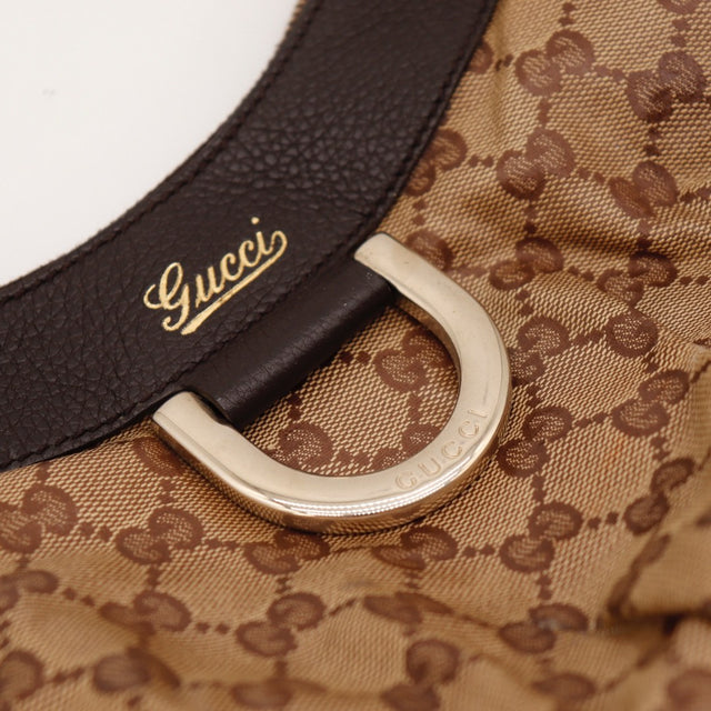 Vue de dos Gucci Hobo D-Ring toile GG beige occasion authentique — AMANA Vintage