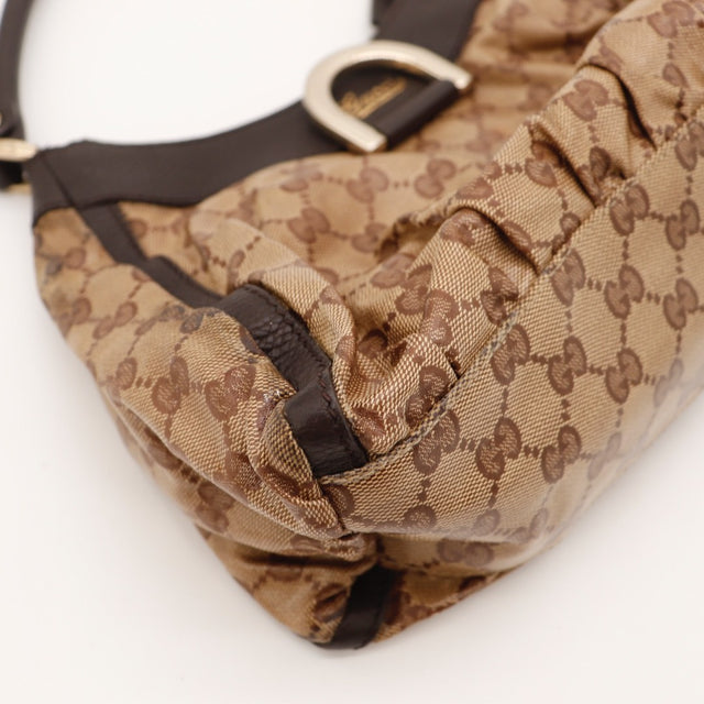 Vue de côté Gucci Hobo D-Ring toile GG beige — AMANA Vintage