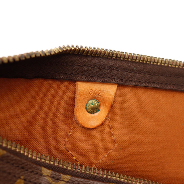 Détail intérieur Louis Vuitton Speedy 35 languette vachette numérotée — AMANA Vintage